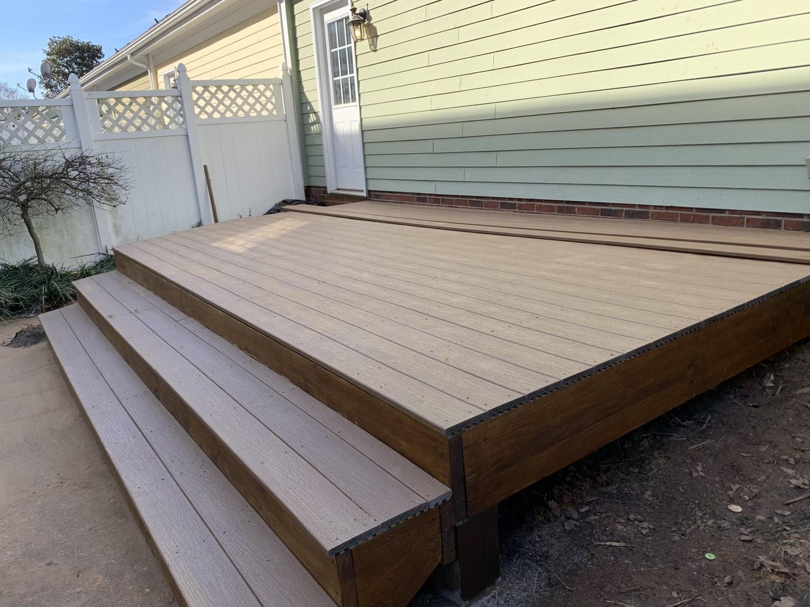 Wide deck steps to the yard