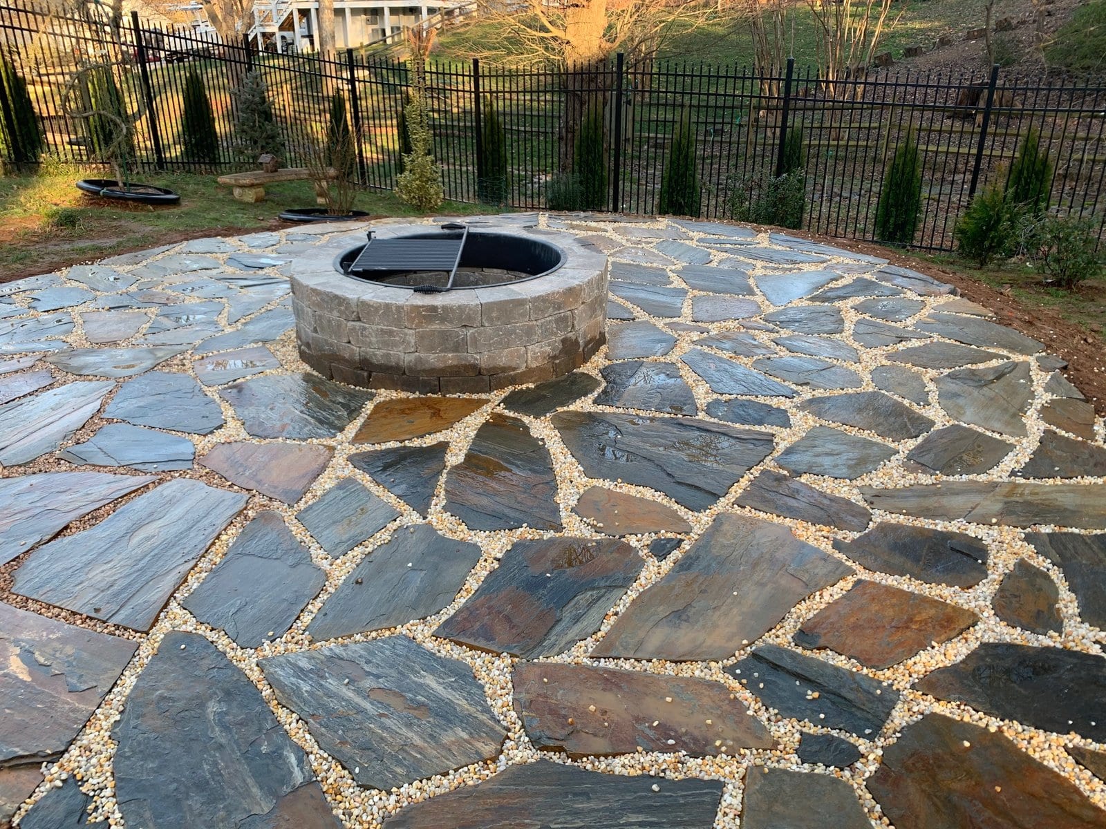 Flagstone patio and fire pit at dusk