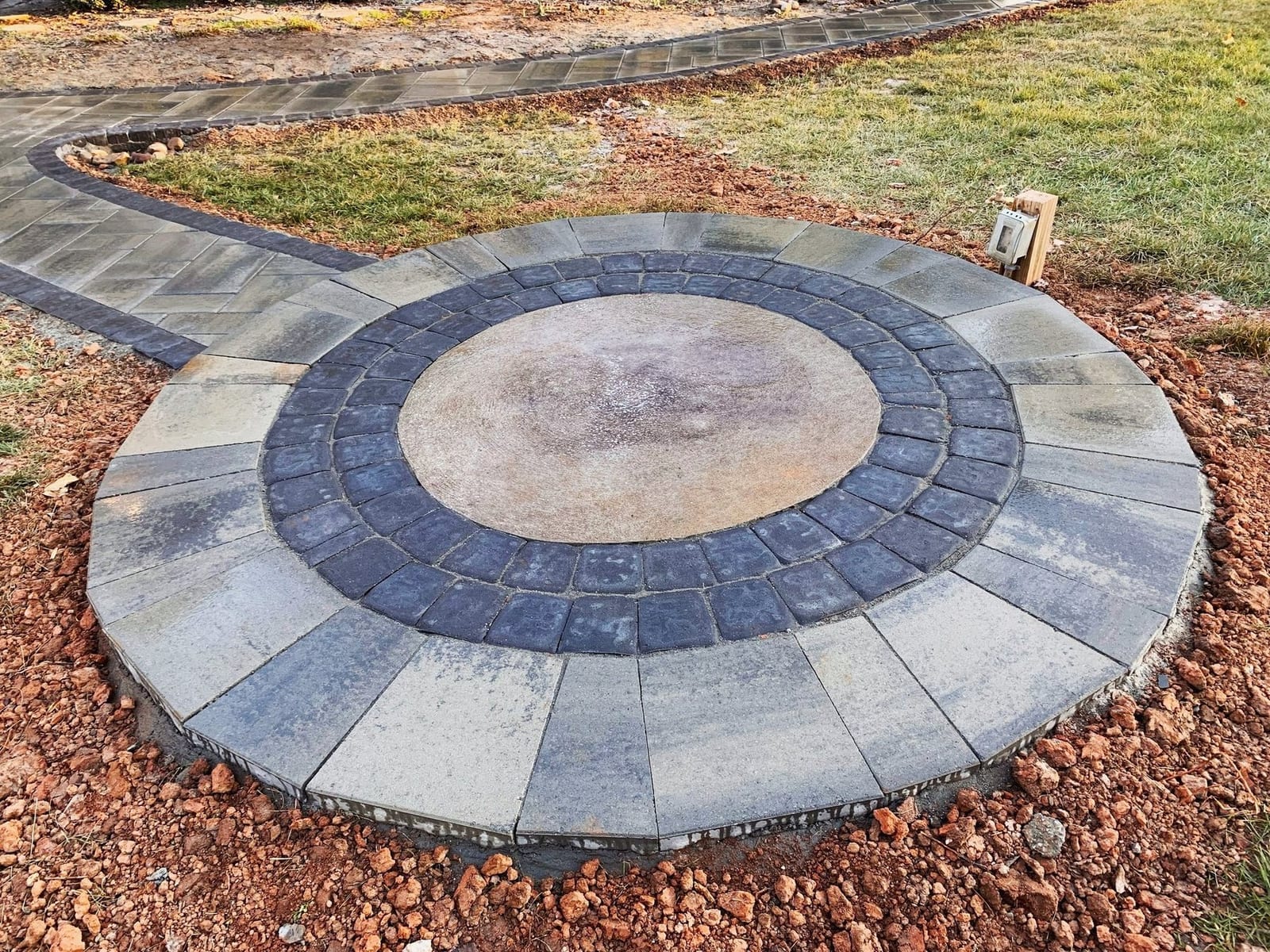 Paver patio with a circular medallion inlay