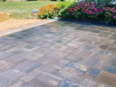 Large paver patio with seating walls