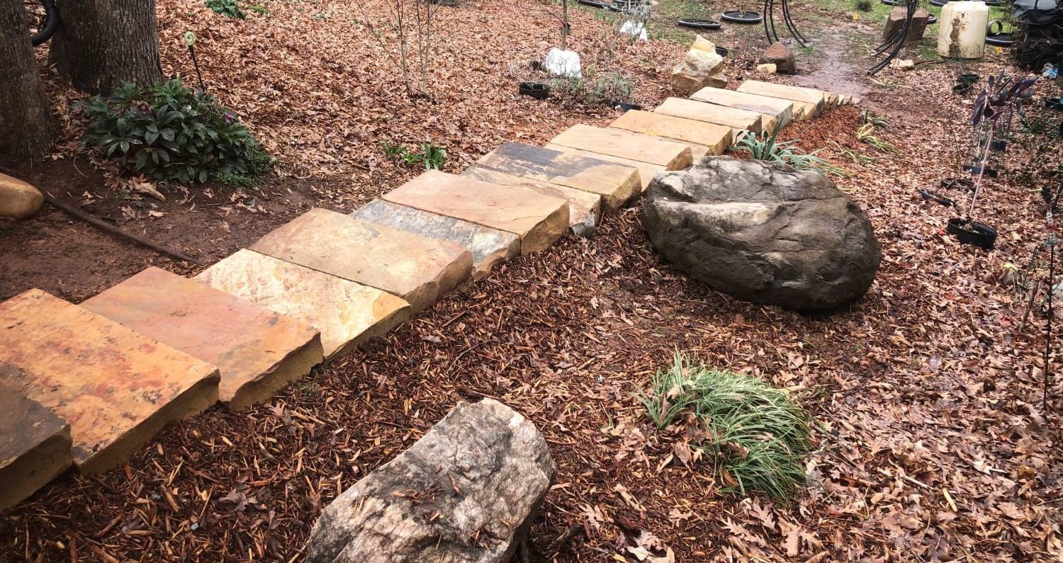 Stone stepping treads set through a planted hillside